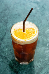 Iced coffee drink with orange slice