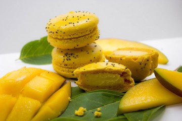  Mango macaroon cake on white background