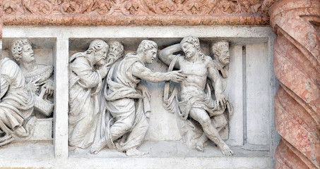 Doubting Thomas by Zaccaria da Volterra, door of San Petronio Basilica in Bologna, Italy