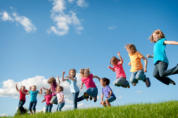 Group of Girls Jumping Together Outside - Unity, Friendship