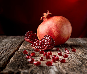 Ripe pomegranate  on wooden background.