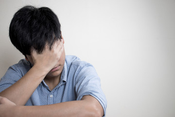 Obraz premium Pictures of people are stressed or have problems with life which sit alone in the room