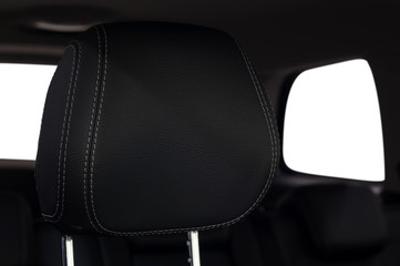 Car leather headrest. Interior detail.