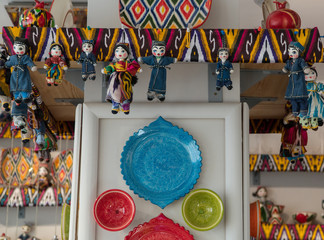 dolls and dishes in traditional Oriental ornaments. national uzbek souvenirs