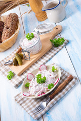 delicious homemade meat salad with mayonnaise and cucumber