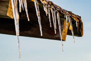 icicle in Winter on a old roof in Germany Rheinlandpfalz Gerolstein in Sunset