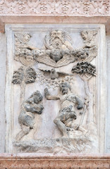 Baptism of Christ by Lazzaro Casario, right door of San Petronio Basilica in Bologna, Italy