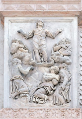 Fototapeta na wymiar Transfiguration of the Lord by Giacomo Scilla, right door of San Petronio Basilica in Bologna, Italy