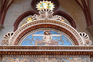 Symbols of the Passion in a lunette, San Petronio Basilica in Bologna, Italy