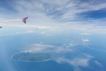Fototapeta premium Air plane wing over the land. Can use for airline transportation background.
