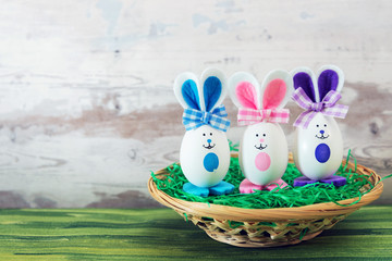 Easter rabbit and eggs with colorful eggs around and white background