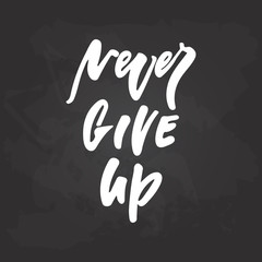 Never Give up - hand drawn October Breast Cancer Awareness Month lettering phrase on black chalkboard background. Brush ink vector quote for banners, greeting card, poster design.