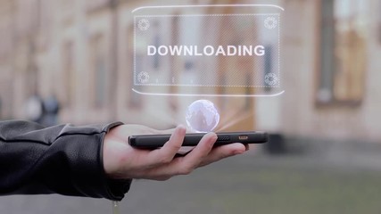 Male hands show on smartphone conceptual HUD hologram Downloading. Man with the future technology mobile holographic screen on blurred background of the university