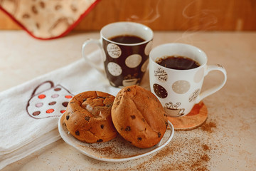 cup of coffee and cookies on wooden table