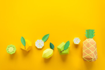Fruit made of paper. Yellow background. There's room for writing. Tropics. Flat lay. Pineapple,...