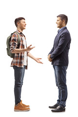 Teenage male student talking to a young man