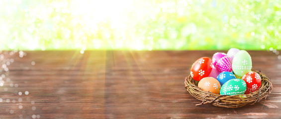 bright early colored easter eggs on a sunny spring background