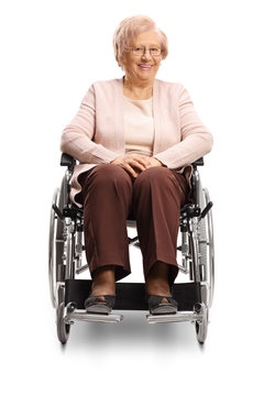 Senior woman sitting in a wheelchair and smiling at the camera