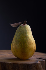 ripe pear on a wooden board