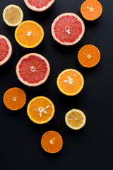 Orange, Grapefruit, Mandarine And Lemon Fruit On Black Background