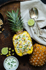 Homemade rice with cashew in pineapple.