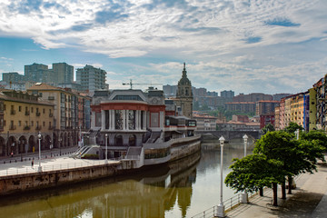 Naklejka premium Bilbao riverbank on cloudny day