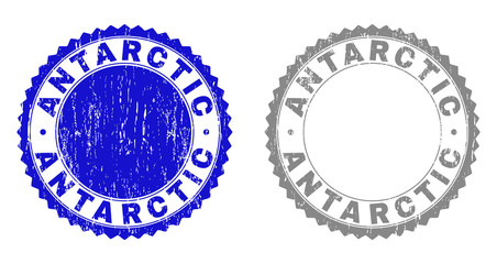 Grunge ANTARCTIC stamp seals isolated on a white background. Rosette seals with grunge texture in blue and gray colors. Vector rubber imitation of ANTARCTIC text inside round rosette.
