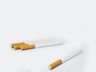 brown cigarettes on isolated white background