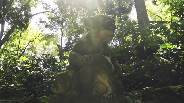 Low angle shot of two ancient animal creature statue in Ubud, at the Monkey Forest
