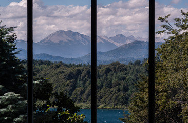 lake in the mountains through the window