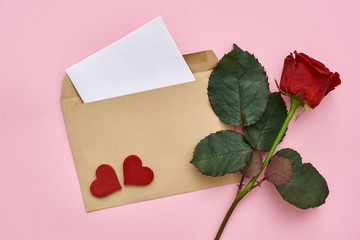 Love letter. Note paper with envelope, red rose and decorative hearts