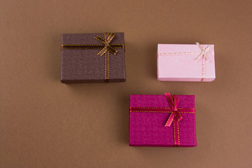 top view flat lay gift boxes on a brown background