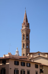 Fototapeta premium Bell tower of the Badia Fiorentina church view from the Piazza San Firenze at historic center of Florence, Tuscany, Italy