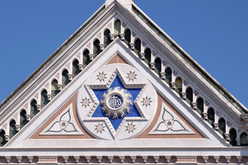 Obraz premium IHS sign, Basilica di Santa Croce (Basilica of the Holy Cross) - famous Franciscan church in Florence, Italy