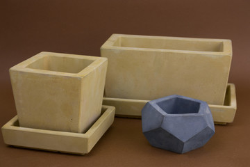 set of painted  concrete pots,  trendy element of  modern interior design