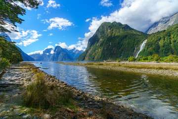 big waterfall at milford sound, fiordland, new zealand 32