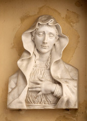 Our Lady of Sorrows on the house facade in Florence, Italy