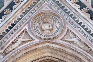 Fototapeta premium Wrapping Christ in his shroud, Portal of Cattedrale di Santa Maria del Fiore (Cathedral of Saint Mary of the Flower), Florence, Italy 