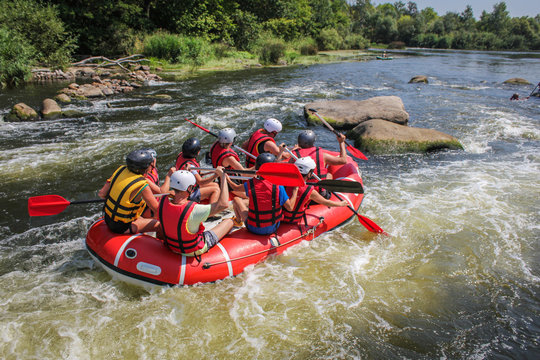Group of adventurer enjoying water rafting activity at Southern Bug river Ukraine. The river is popular for its scenic nature view.