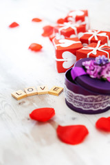 Valentine's Day background photo - rose petals with gift box