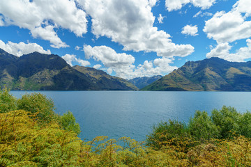 Fototapeta na wymiar mountains at lake wakatipu on a sunny day, otago, southern alps, new zealand 13