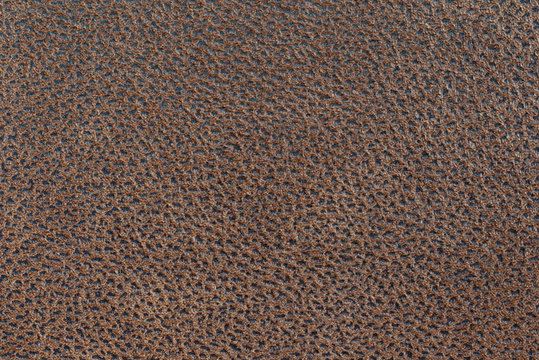 Dark brown leather texture background.