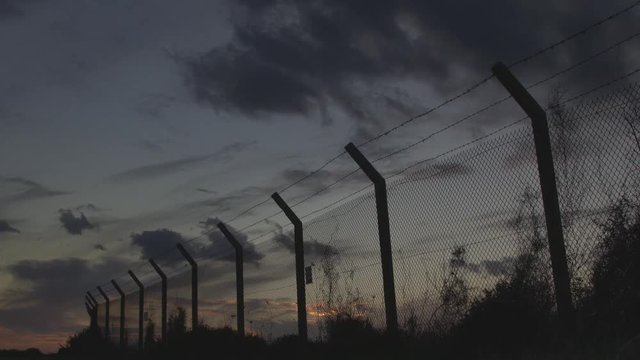 Dramatic sunset clouds over the fense timelapse