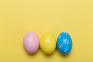 easter eggs on yellow pastel color background with space. Concept
