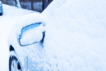 Car mirror after snowstorm