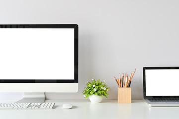 Workspace with mockup computer and office supplies with copy space office desk table.