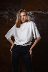 Naklejka premium Test shooting for gorgeous young model wears jeans and shirt