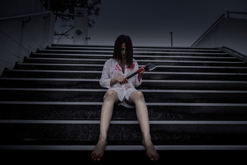 Close up woman wear white shirt in the dark room,Scary movie concept,Horror background,Thailand people