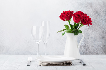 Dinner setting with rose flowers bouquet