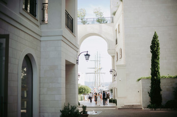 Look from afar at people walking along the street